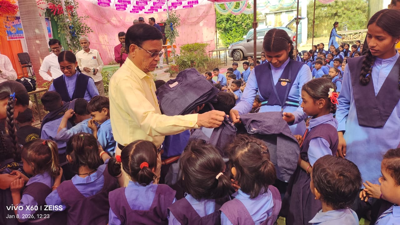 Children's faces lit up after receiving sweaters. Saloni distributed 600 sweaters at Ghumka Complex